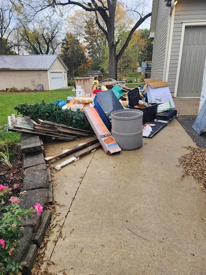 Dumpster being loaded with debris for Roofing Dumpster Rental in Kittery